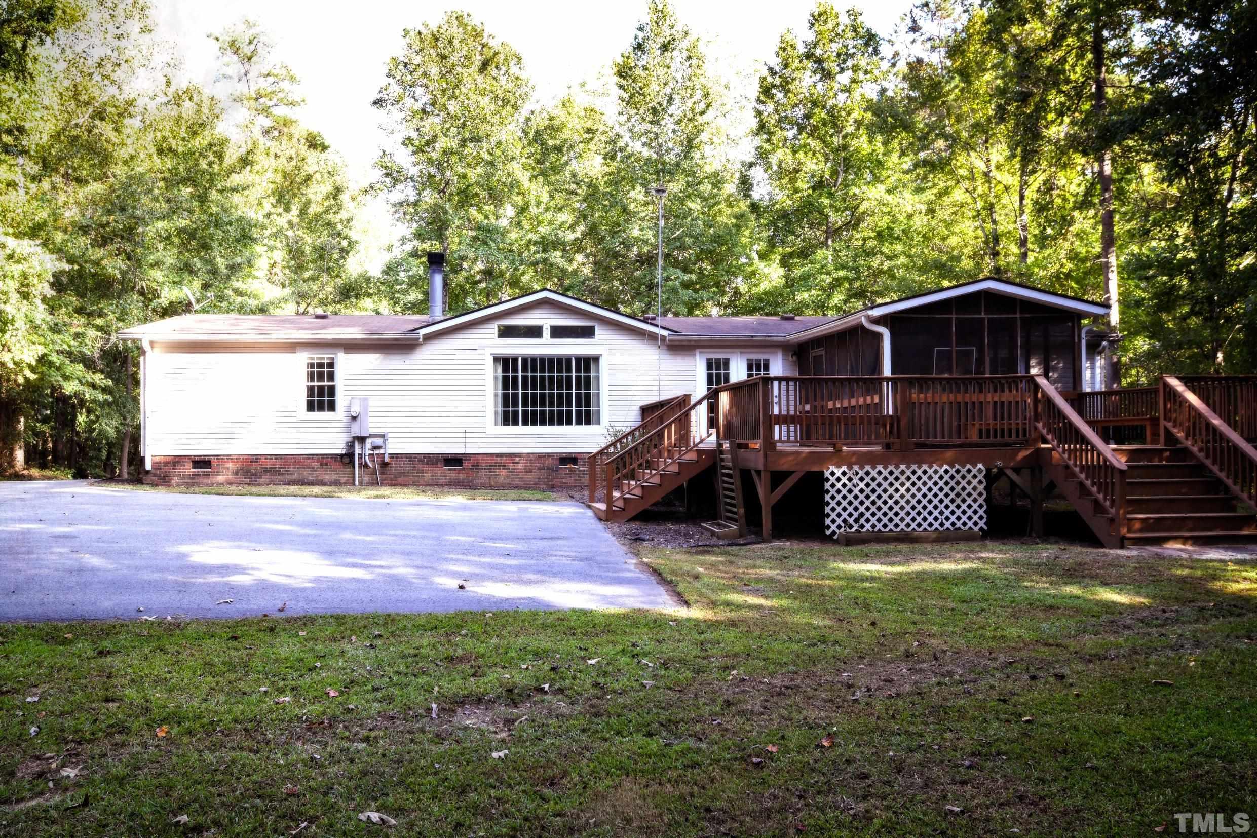 1516 Bill Poole Road Rougemont, NC 27572 - Photo 15 of 17 a view of a house with backyard and sitting area
