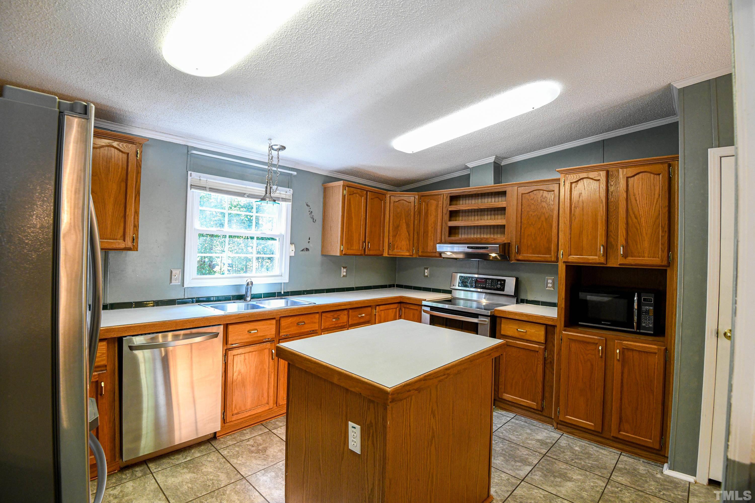 1516 Bill Poole Road Rougemont, NC 27572 - Photo 3 of 17 a kitchen that has a sink and a stove in it