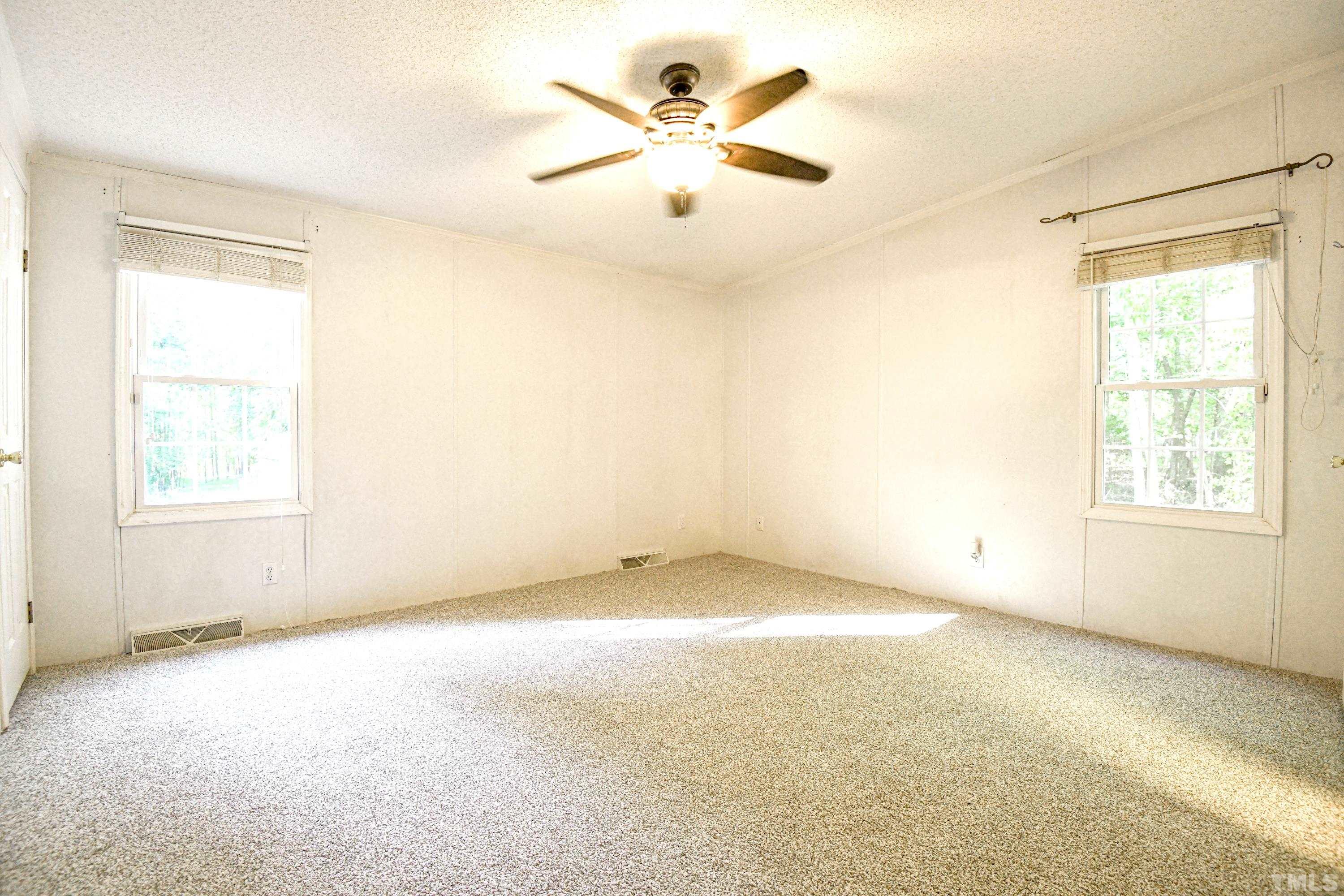 1516 Bill Poole Road Rougemont, NC 27572 - Photo 6 of 17 a view of an empty room with a window