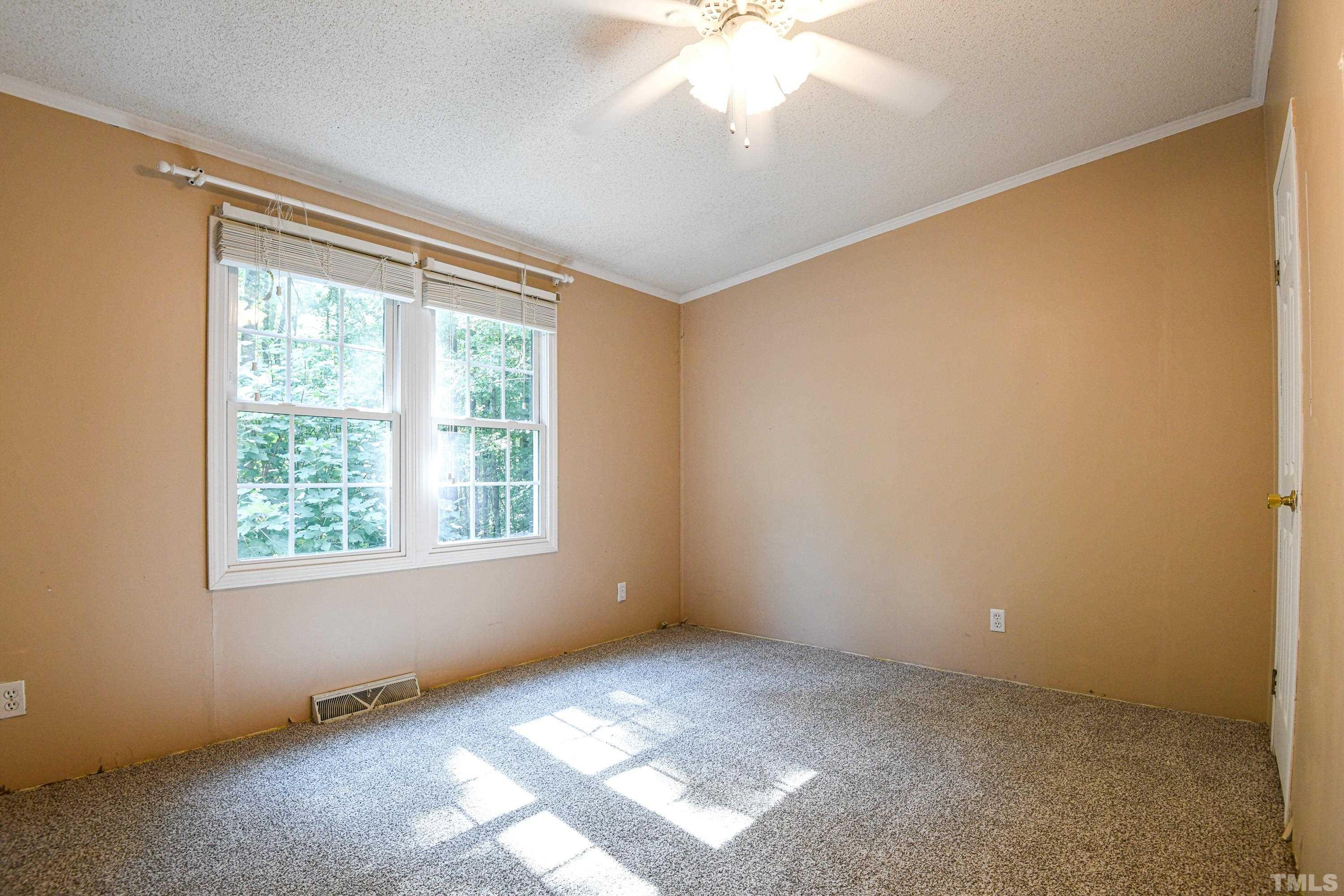 1516 Bill Poole Road Rougemont, NC 27572 - Photo 9 of 17 an empty room with a window