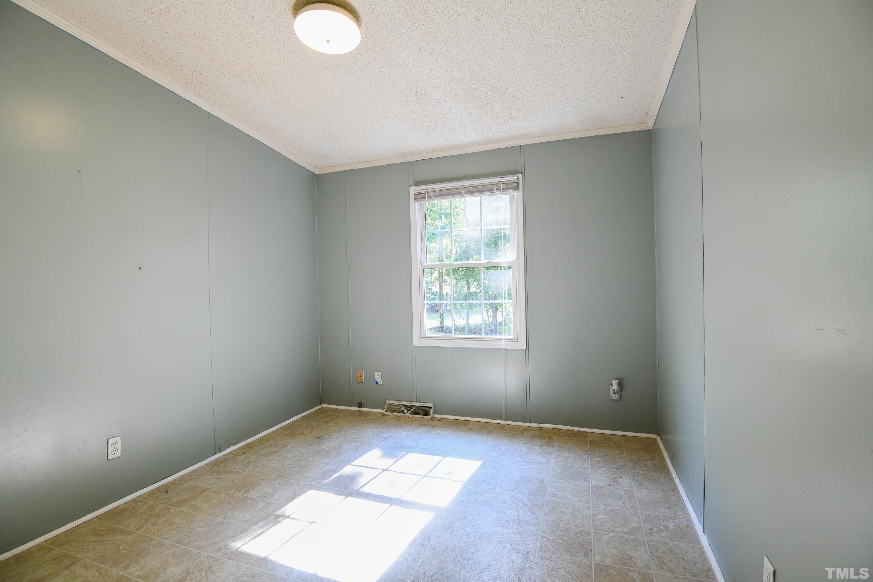 1516 Bill Poole Road Rougemont, NC 27572 - Photo 10 of 17 an empty room with windows