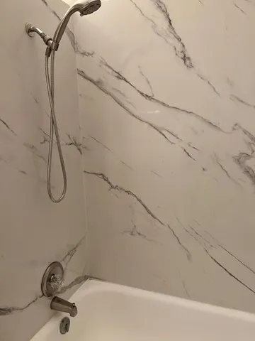 a bathroom with a sink mirror vanity and toilet