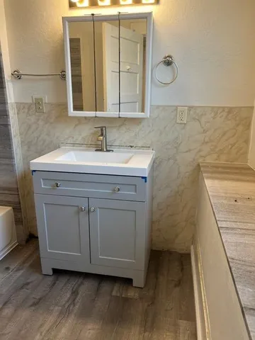 a bathroom with a toilet and a bathtub