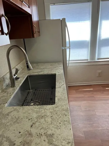 an empty room with wooden floor