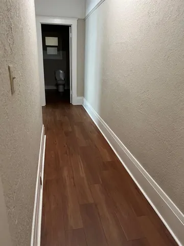 wooden floor in white room