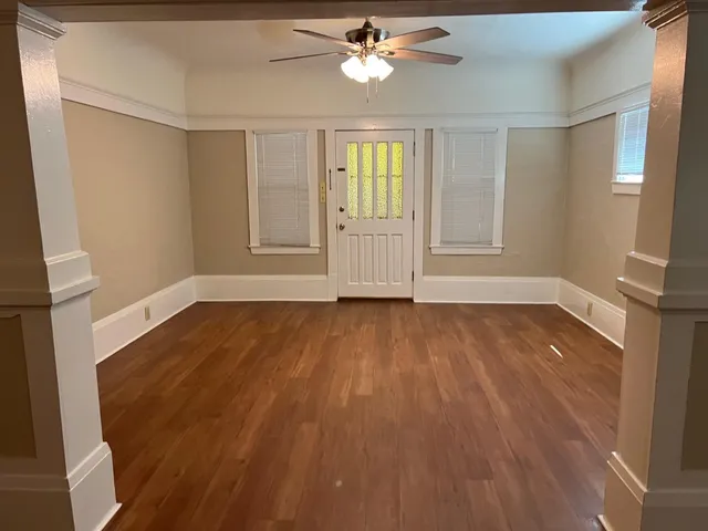 a view of an empty room with a window