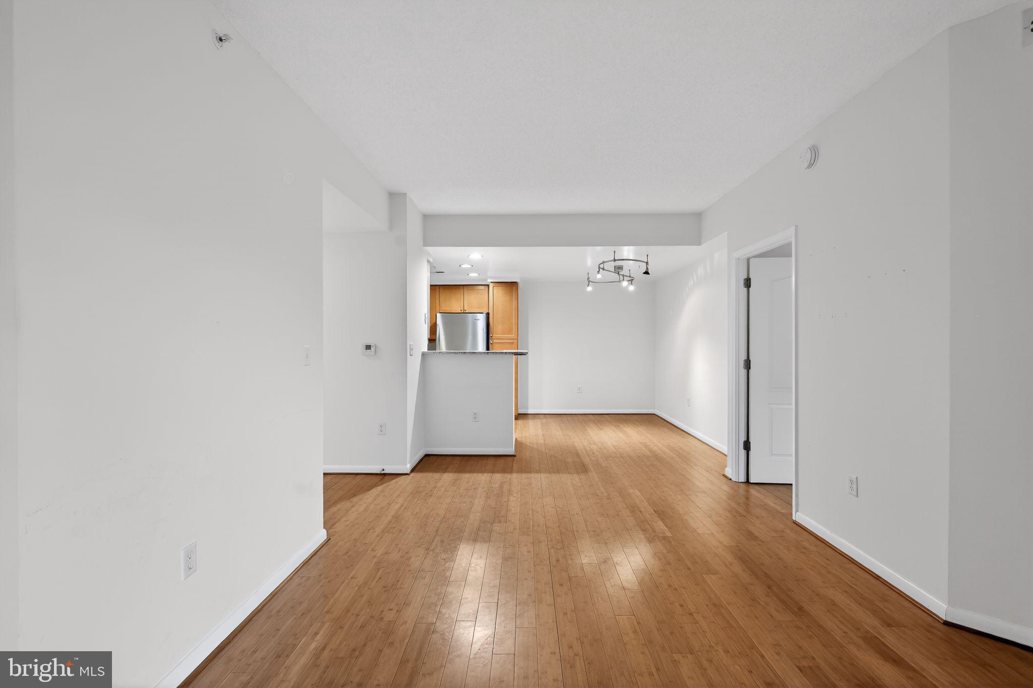 1111 11th Street Northwest, Unit 308 Washington, DC 20001 - Photo 2 of 47 a view of an empty room and wooden floor