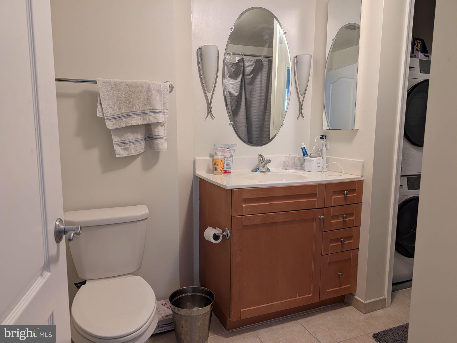 1111 11th Street Northwest, Unit 308 Washington, DC 20001 - Photo 39 of 47 a bathroom with a toilet sink and mirror
