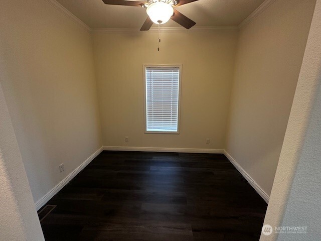 2101 South 324th Street, Unit 174 Federal Way, WA 98003 - Photo 5 of 9 a view of an empty room with wooden floor a ceiling fan and a window