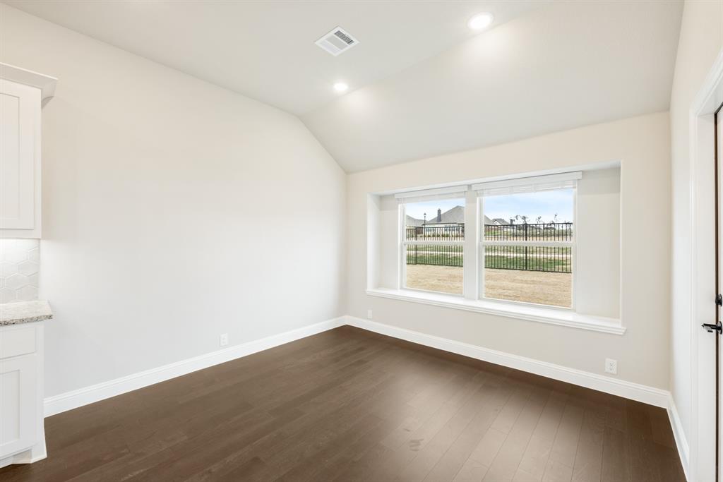 4021 Eagles Bluff Road Midlothian, TX 76065 - Photo 12 of 40 an empty room with wooden floor and windows
