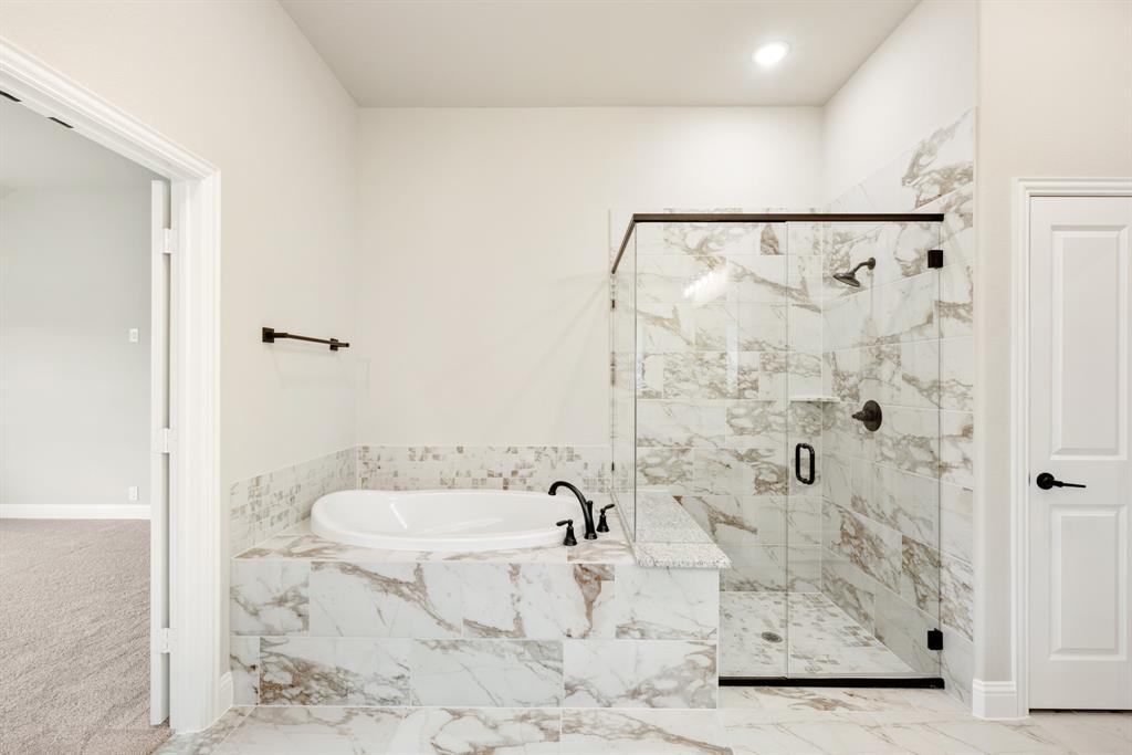 4021 Eagles Bluff Road Midlothian, TX 76065 - Photo 20 of 40 a bathroom with a bathtub and shower