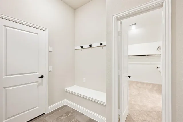 a bathroom with a granite countertop shower