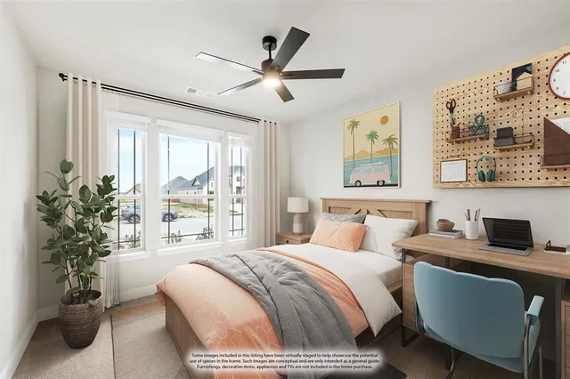 a bedroom with a large bed and a window