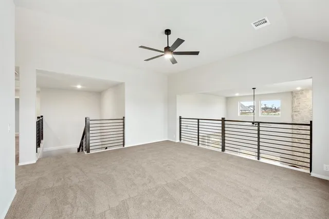 an empty room with windows and entryway