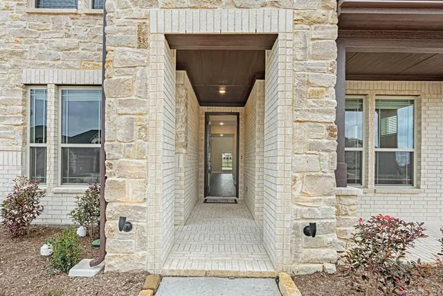 a front view of a brick house with a door