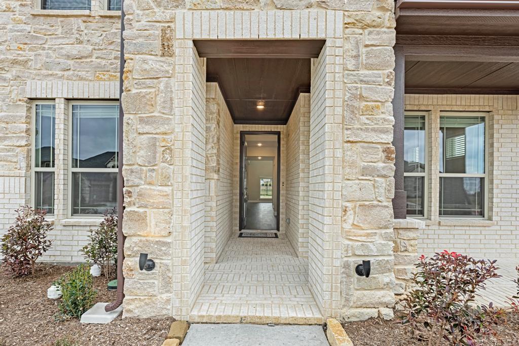 4021 Eagles Bluff Road Midlothian, TX 76065 - Photo 3 of 40 a front view of a brick house with a door