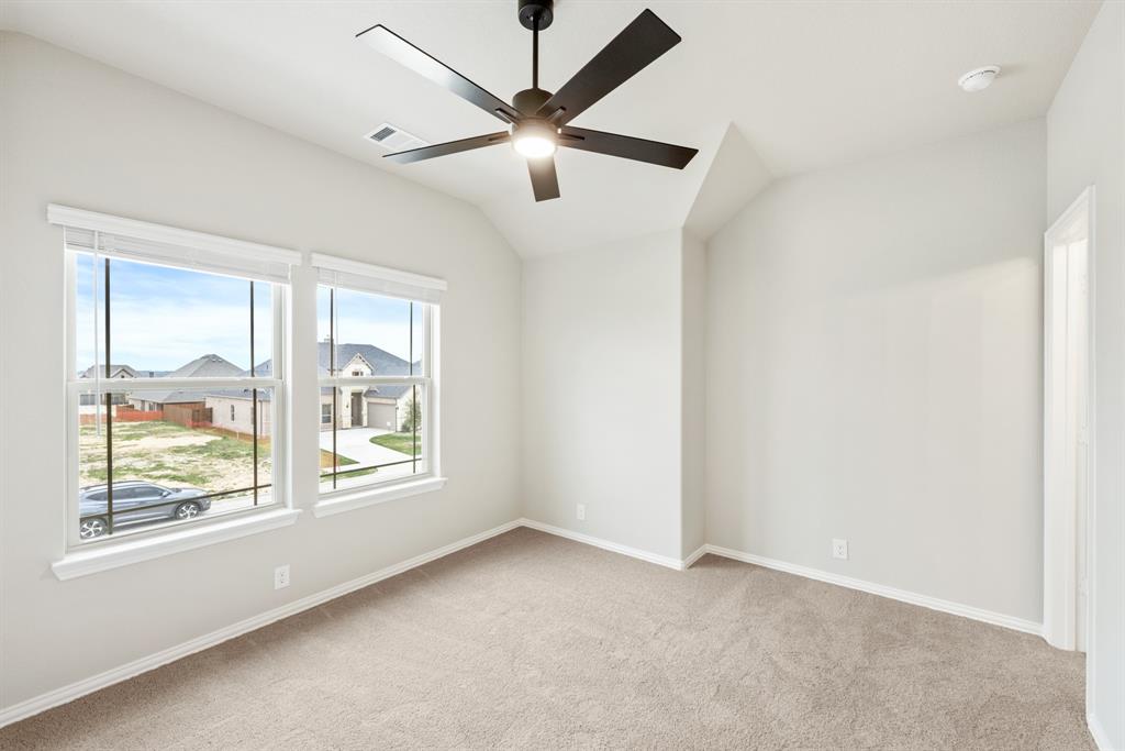4021 Eagles Bluff Road Midlothian, TX 76065 - Photo 32 of 40 an empty room with windows and fan