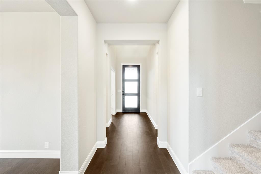 4021 Eagles Bluff Road Midlothian, TX 76065 - Photo 4 of 40 a view of a hallway with wooden floor