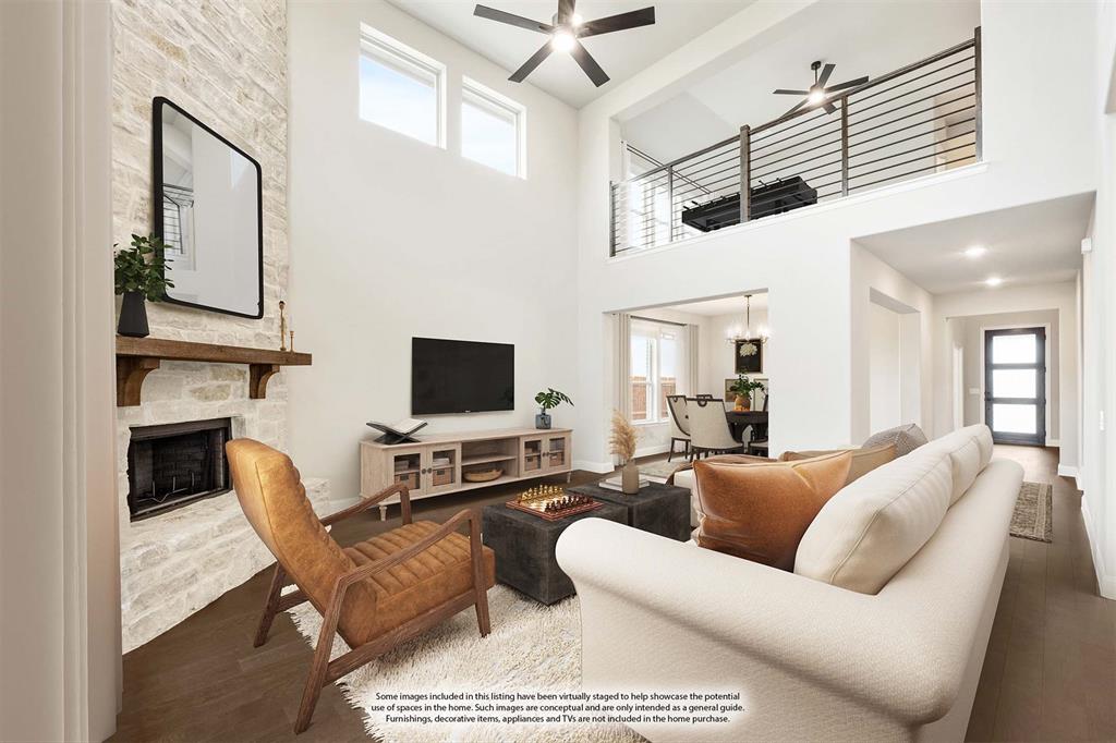 4021 Eagles Bluff Road Midlothian, TX 76065 - Photo 6 of 40 a living room with furniture a flat screen tv and kitchen view