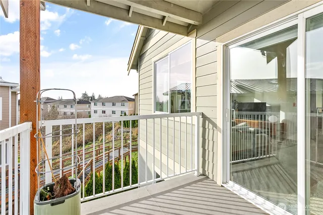a view of a balcony with a floor to ceiling window
