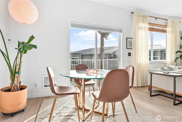 a view of a dining room with furniture window and wooden floor