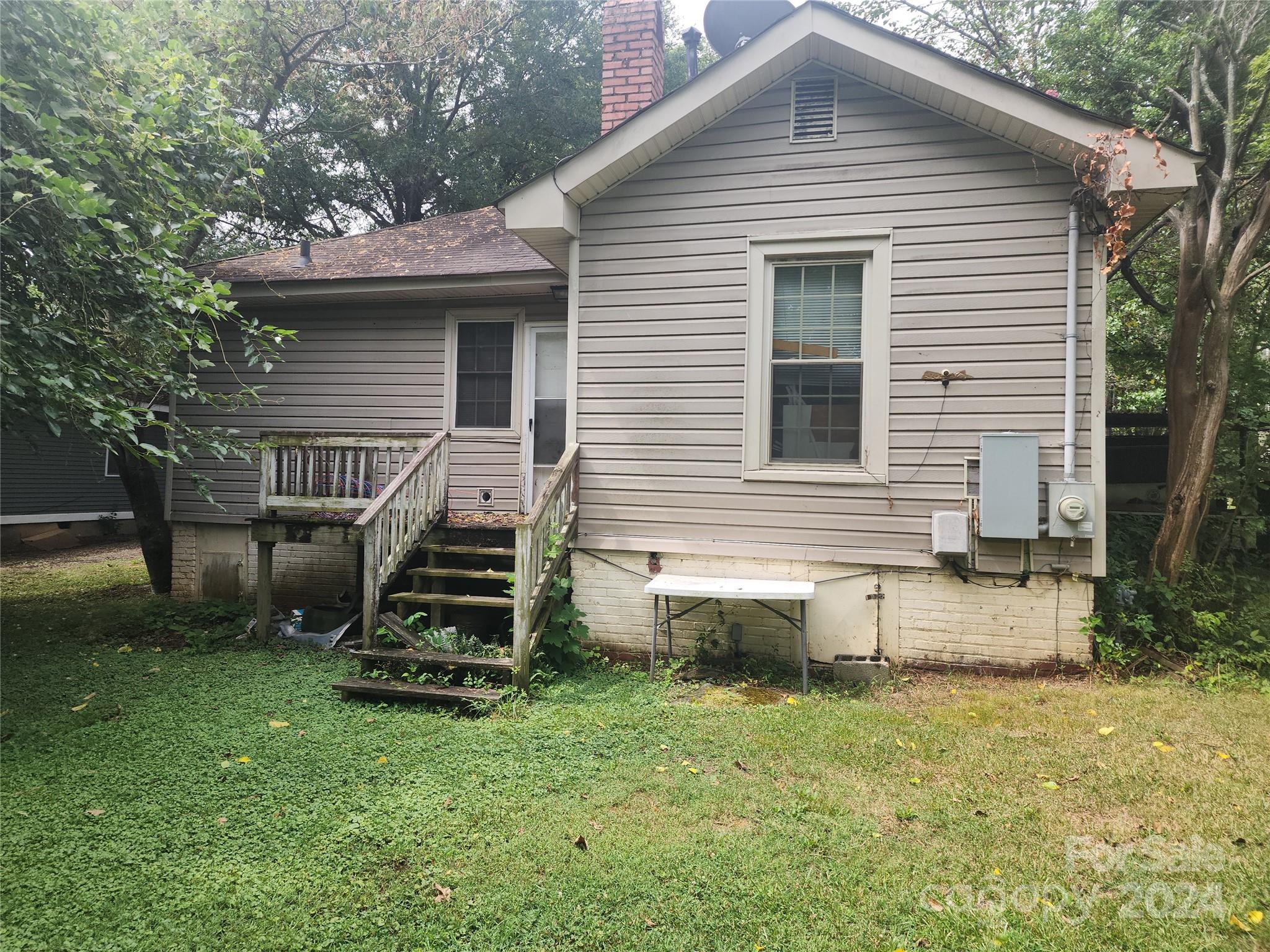 4616 Hovis Road Charlotte, NC 28208 - Photo 11 of 14 a front view of a house with a yard