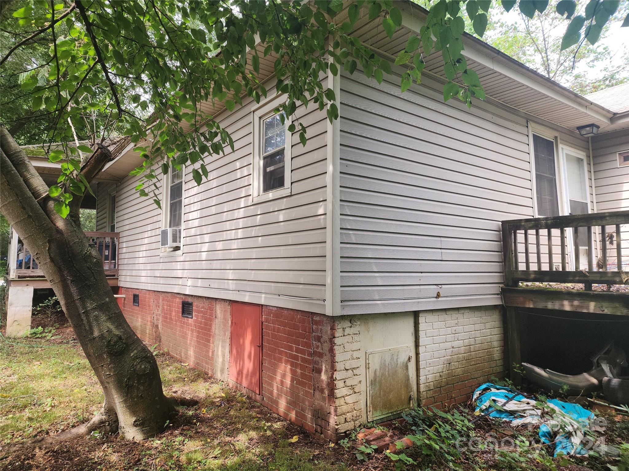 4616 Hovis Road Charlotte, NC 28208 - Photo 12 of 14 a view of a house with a yard and a tree