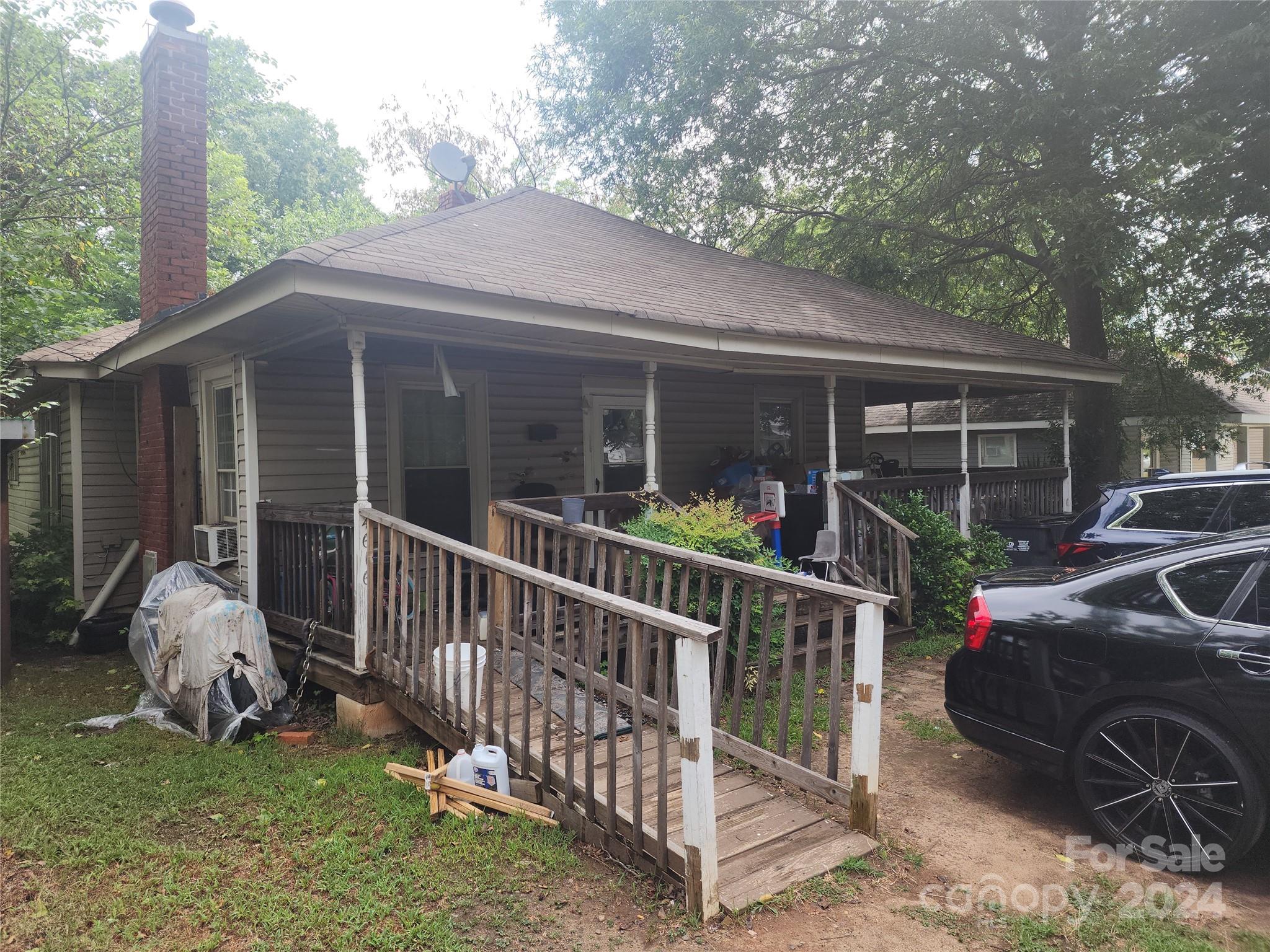 4616 Hovis Road Charlotte, NC 28208 - Photo 2 of 14 a view of a house with backyard porch and porch