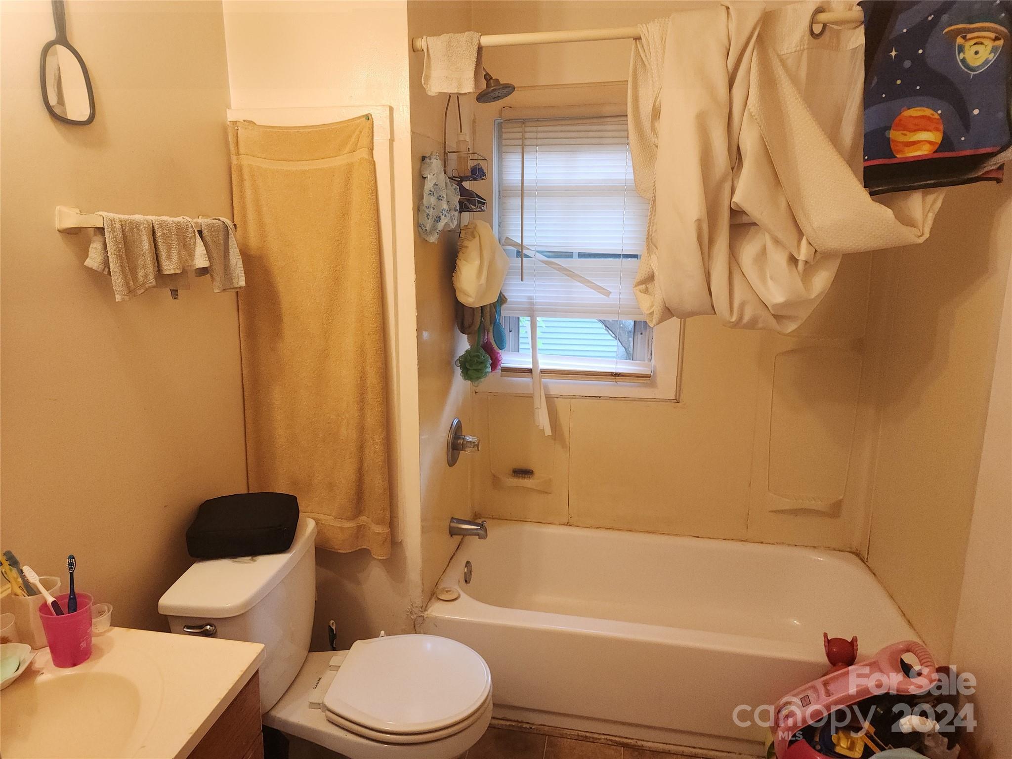 4616 Hovis Road Charlotte, NC 28208 - Photo 7 of 14 a bathroom with a toilet and a shower