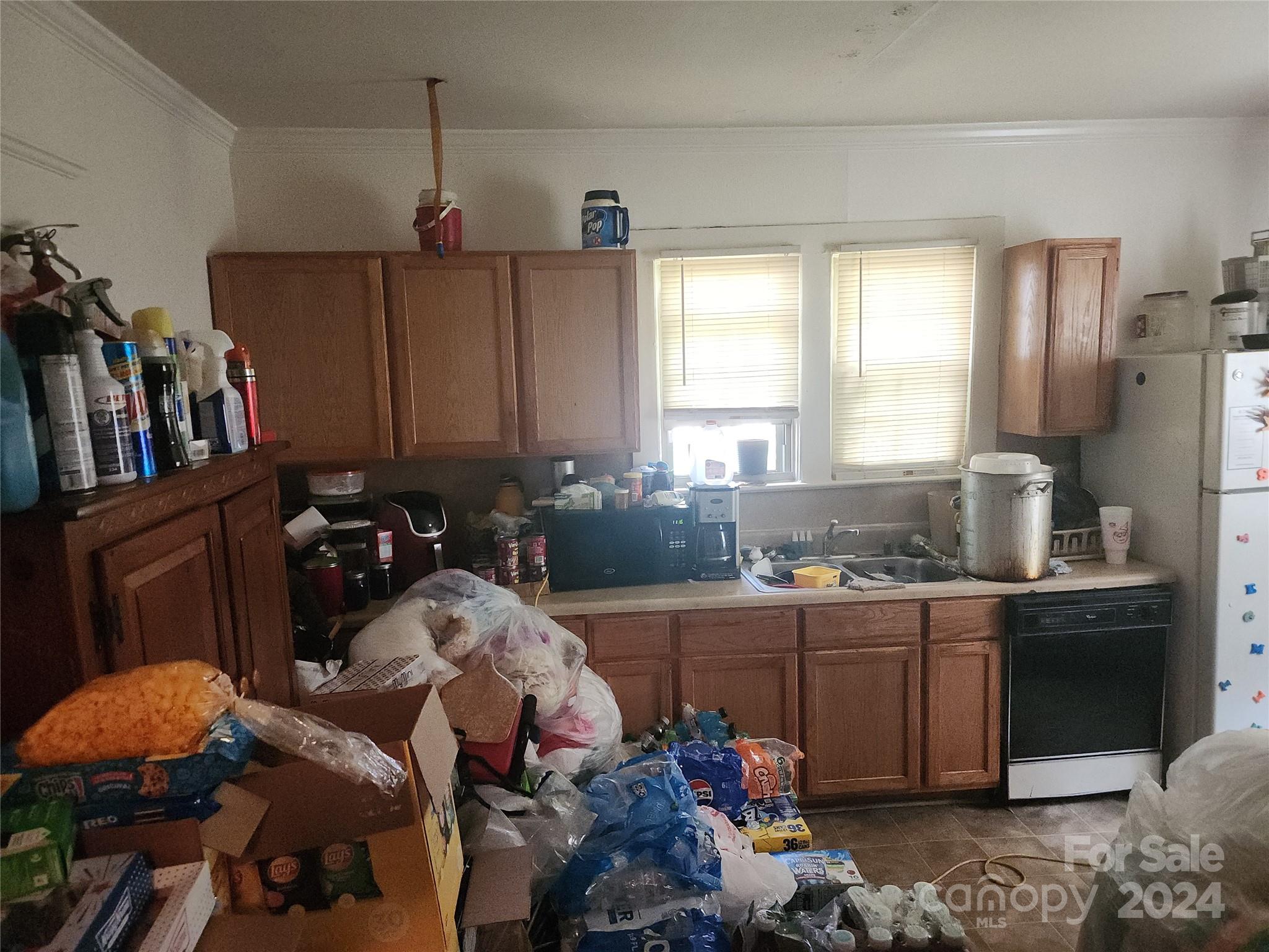 4616 Hovis Road Charlotte, NC 28208 - Photo 8 of 14 a kitchen that has a lot of cabinets a sink and a stove in it