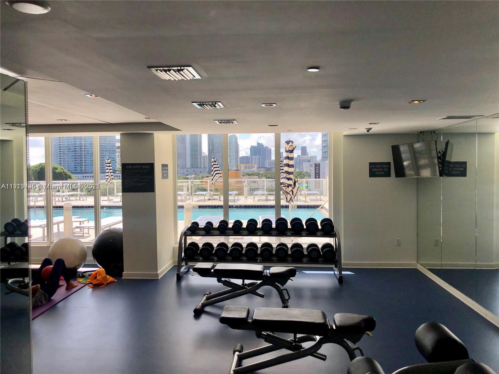 4250 Biscayne Boulevard, Unit 1601 Miami, FL 33137 - Photo 15 of 19 a view of a room with gym equipment