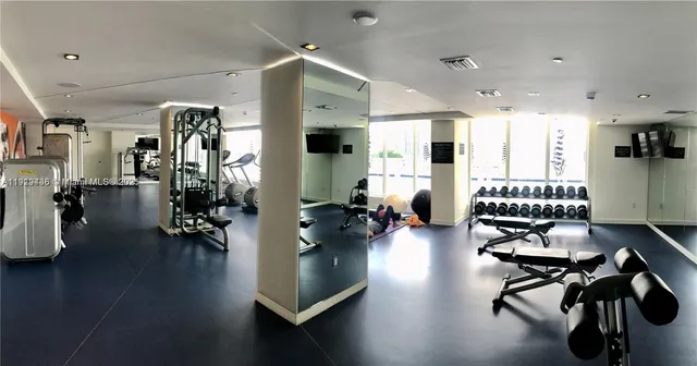 a view of a swimming pool with outdoor seating and plants