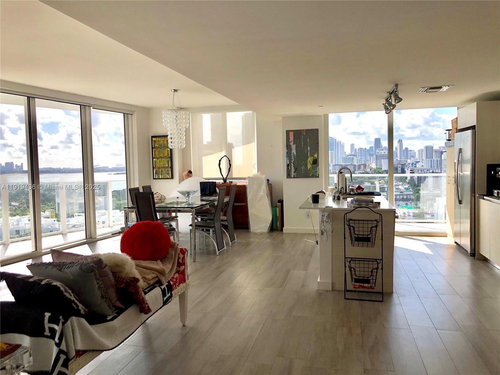 4250 Biscayne Boulevard, Unit 1601 Miami, FL 33137 - Photo 5 of 19 a living room with furniture and a large window