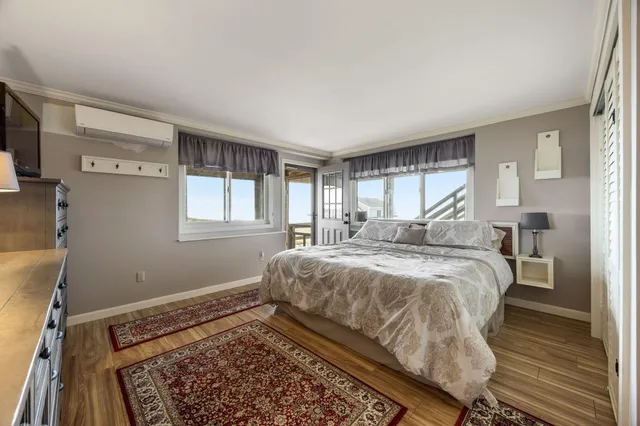 a bathroom with a granite countertop sink a toilet and a mirror