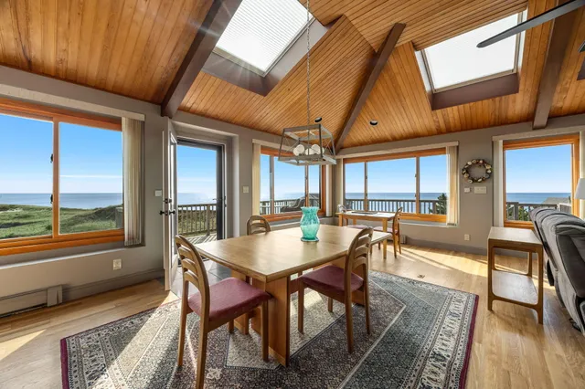 a bathroom with a granite countertop toilet sink and mirror