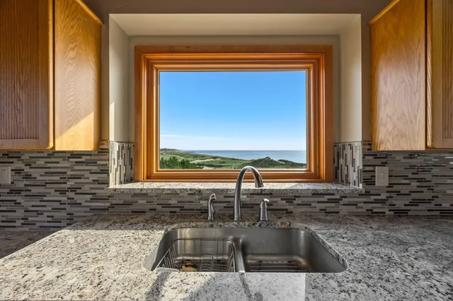 a view of a balcony with wooden floor