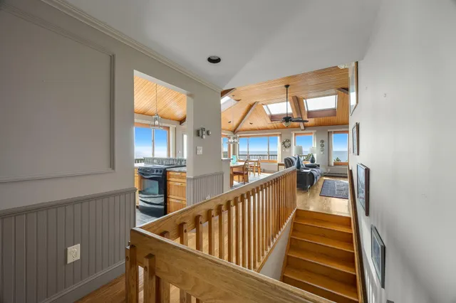 an aerial view of a house with a ocean view
