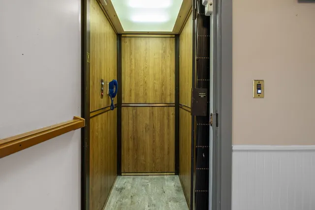 an aerial view of residential house with outdoor space and river