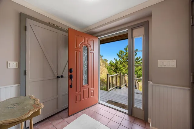 a bedroom with two beds and a window