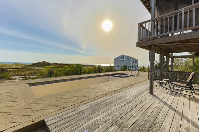 an aerial view of residential house with outdoor space and river