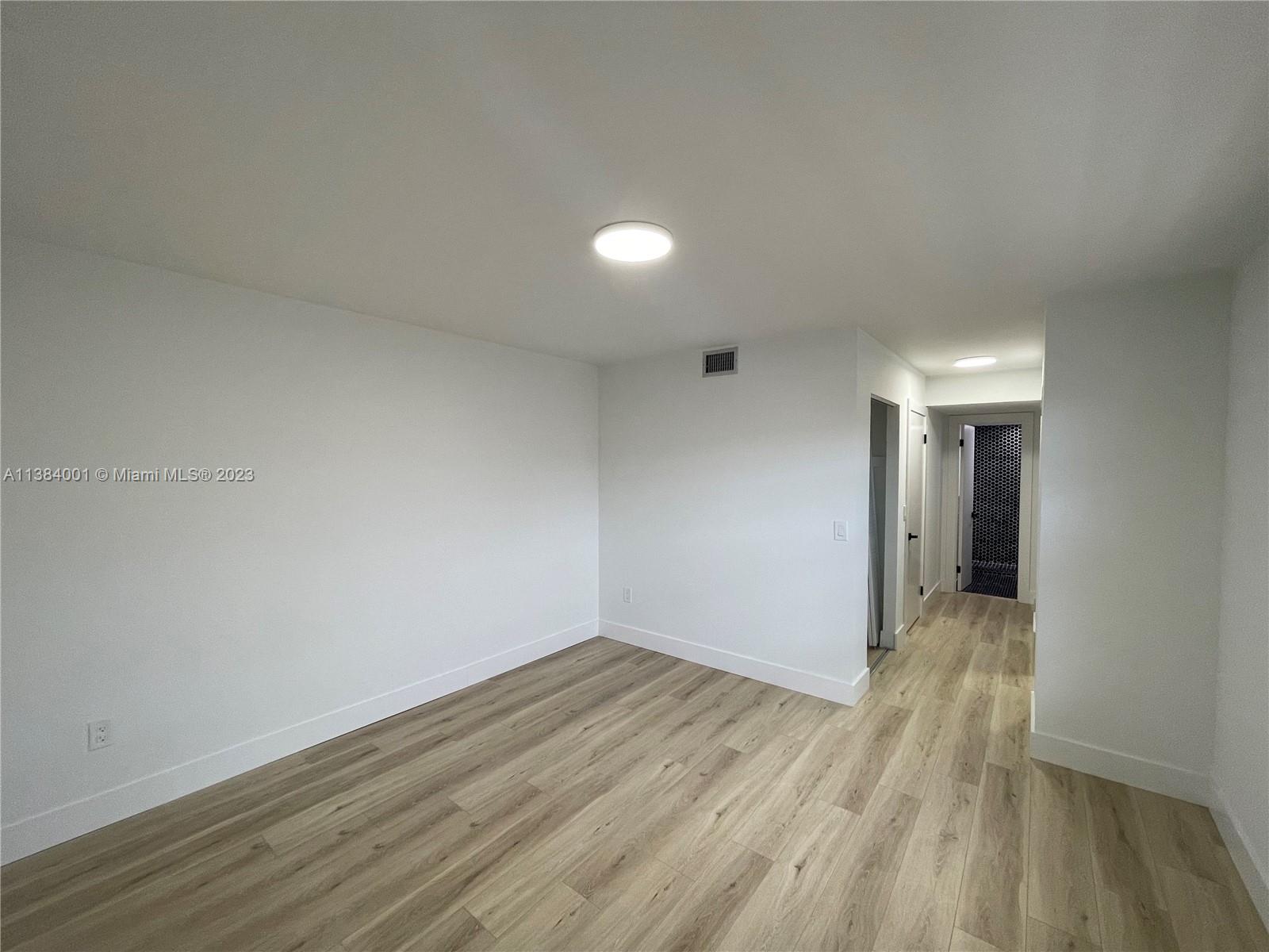 7765 Southwest 86th Street, Unit F2412 Miami, FL 33143 - Photo 21 of 53 a view of a room with wooden floor