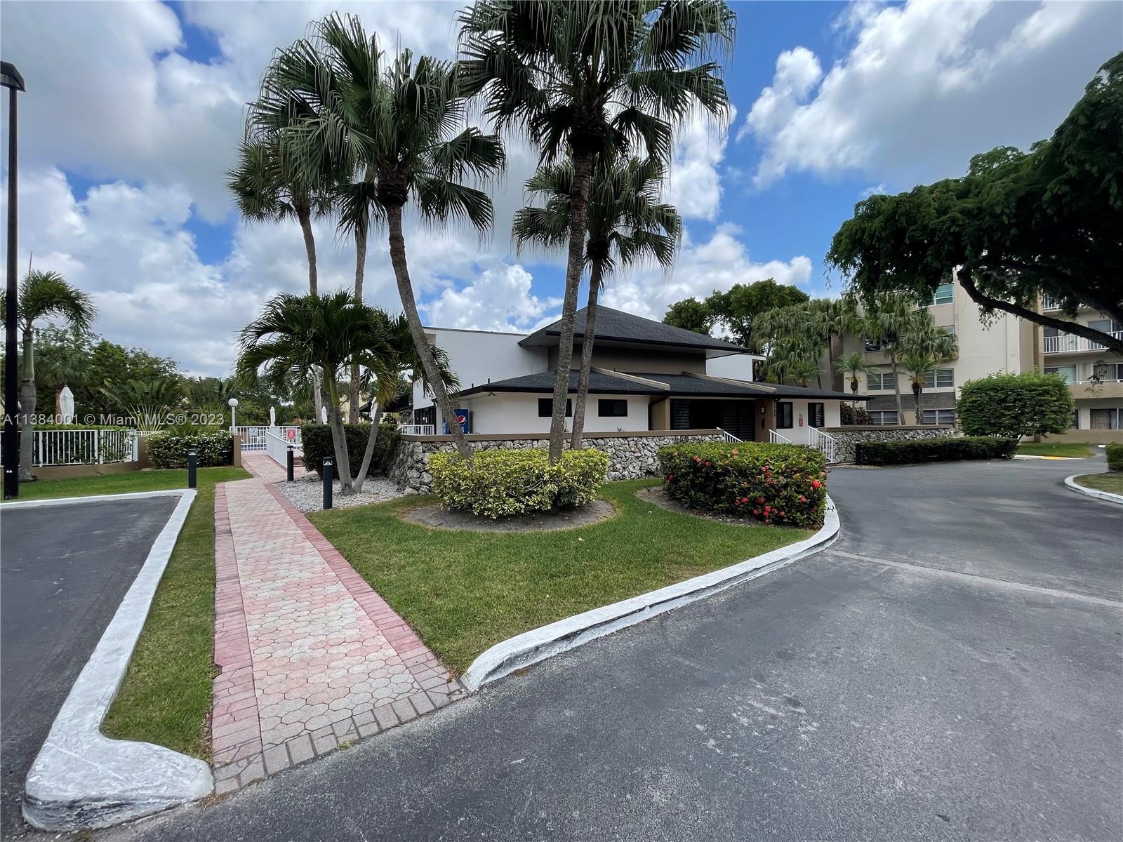 7765 Southwest 86th Street, Unit F2412 Miami, FL 33143 - Photo 45 of 53 a view of a park with a street