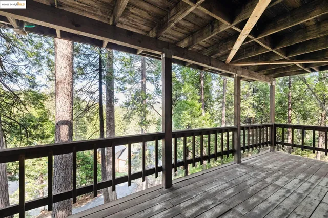 a view of porch with wooden floor