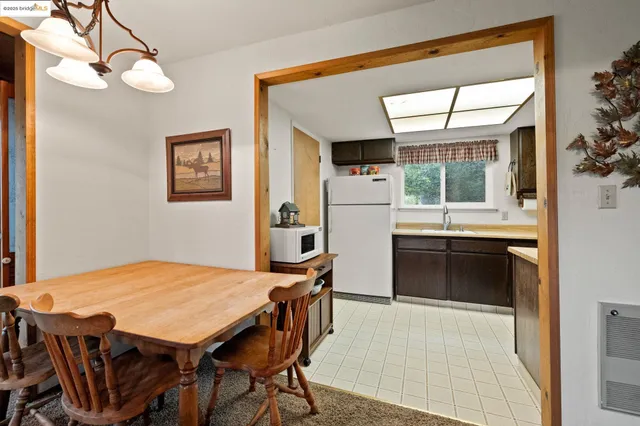 a open kitchen with a table and chairs