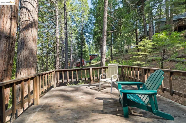 a view of balcony with wooden floor and outdoor seating
