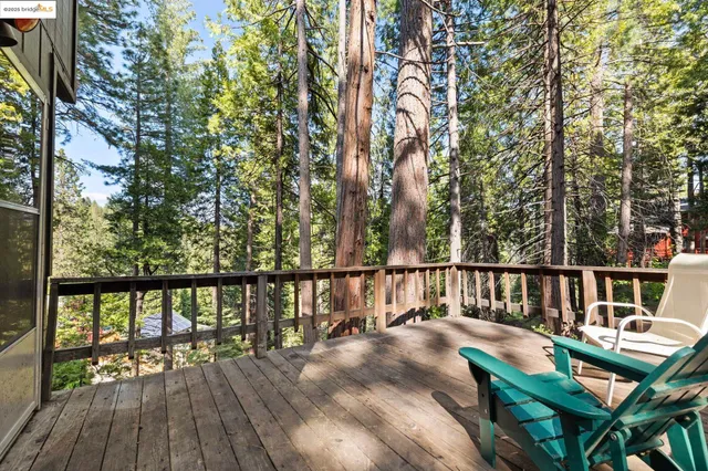 a view of balcony with wooden floor and outdoor seating