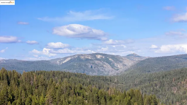 a view of a city and mountains in the background