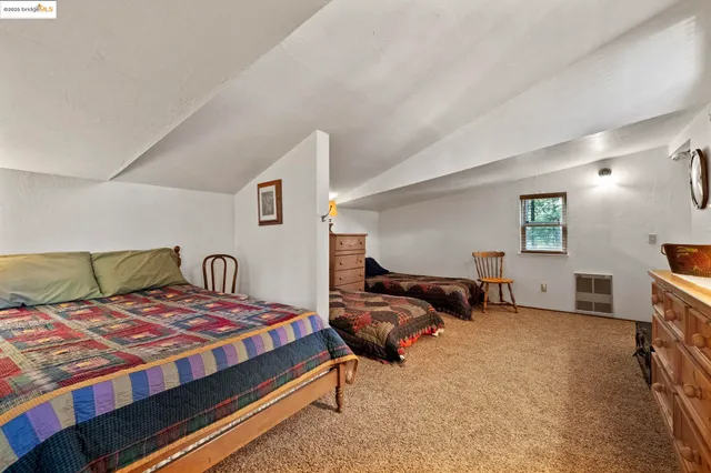 a bedroom with a bed and furniture