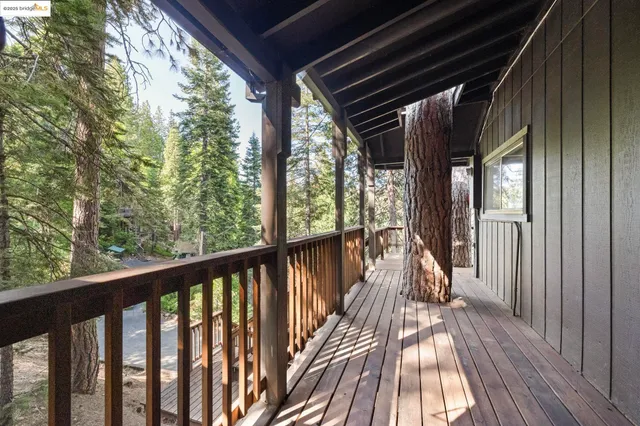 a view of balcony with wooden floor