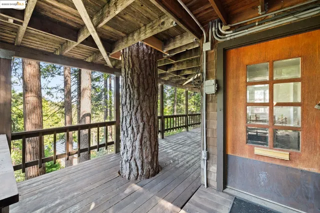 a view of porch with wooden floor and stairs